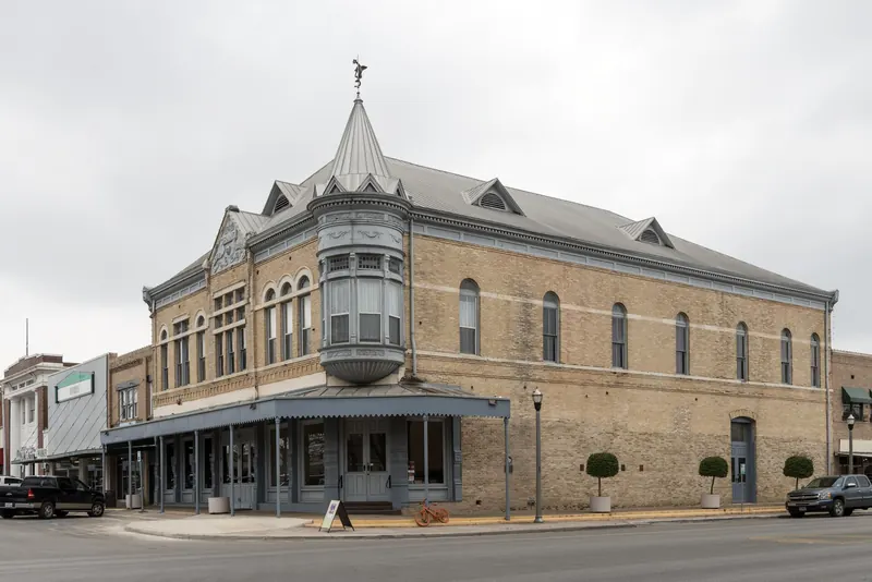 Historic brick Grand Opera House commercial building on a downtown corner in Uvalde, Texas