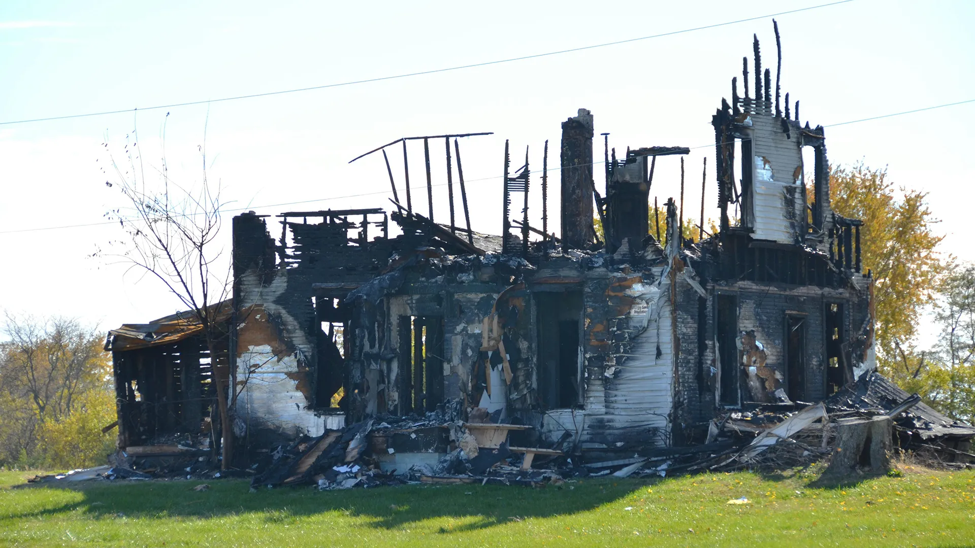 Fire-damaged house showing the extent a property loss can reach beyond visible smoke residue